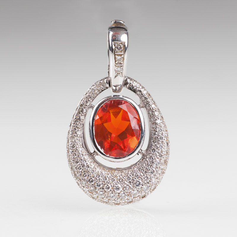 A large diamond garnet clip pendant