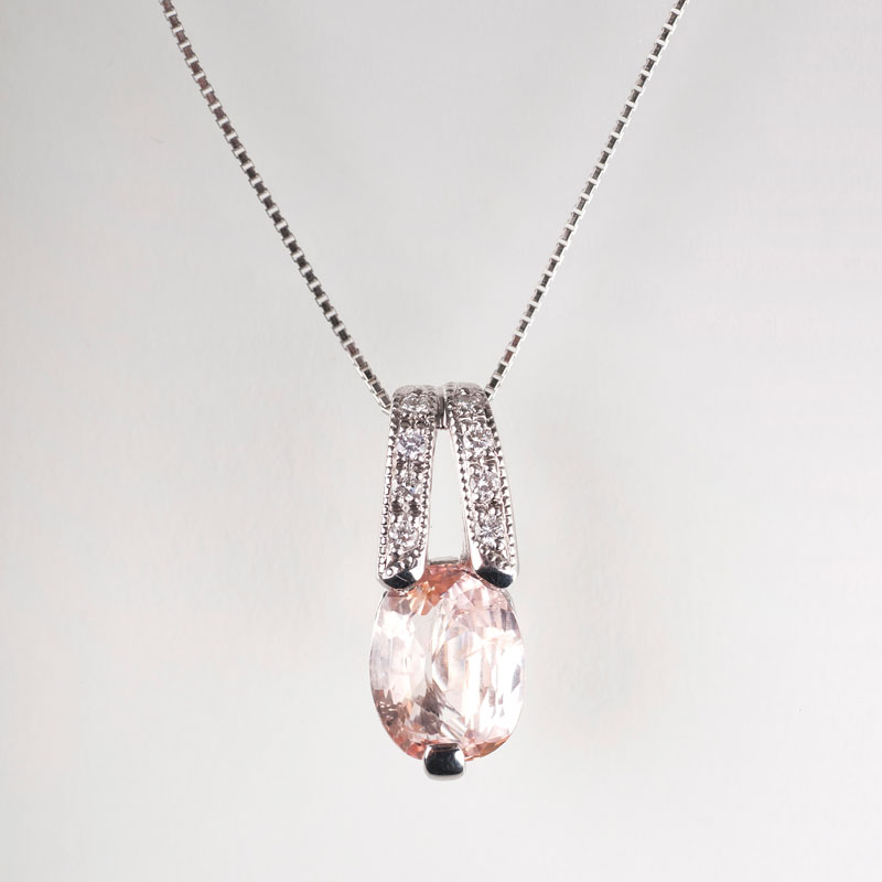 A rare sapphire pendant with diamonds and petite necklace