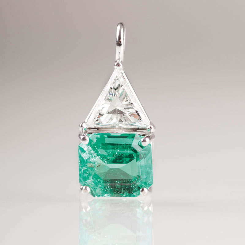 A very fine pendant with a natural emerald and diamond