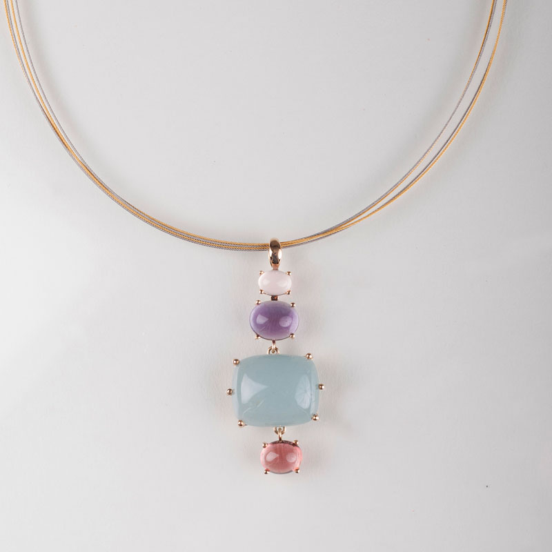 A coloured stone pendant on bangle necklace