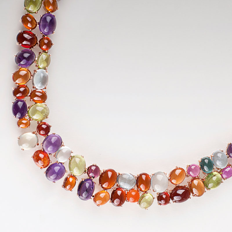A modern, highcarat necklace with rich coloured stone setting