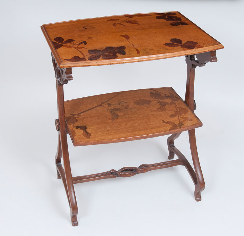 An Art Nouveau two-tier table with marquetry decor