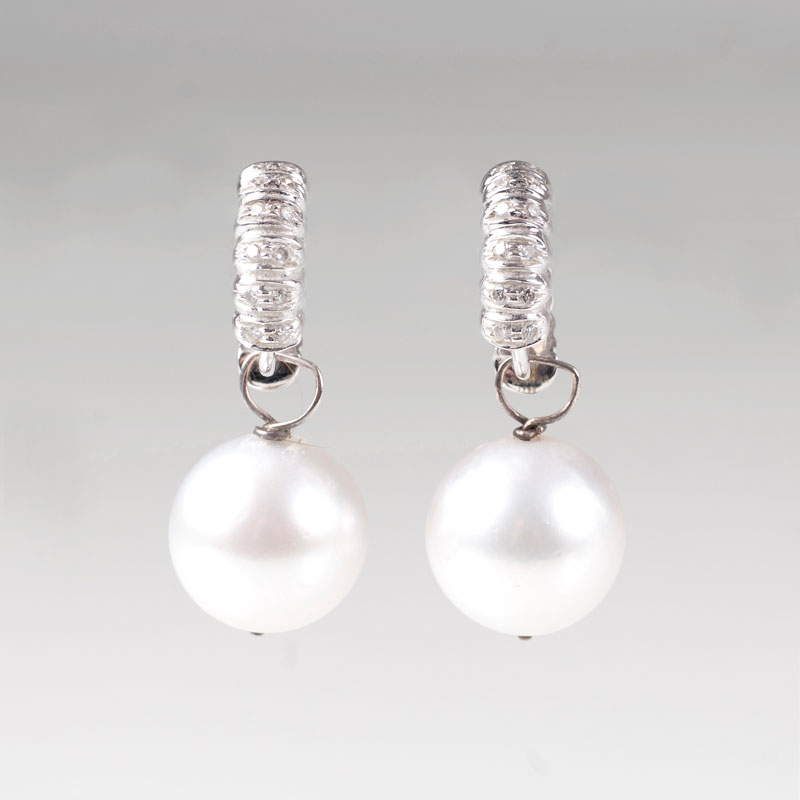 A pair of Southsea pearl earrings with diamonds