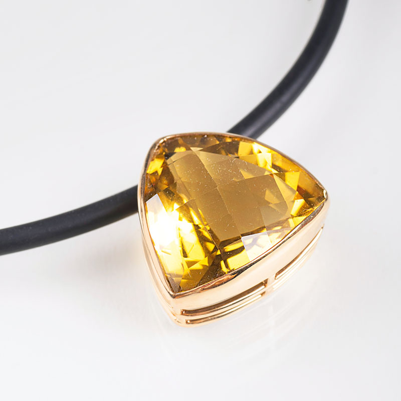 A necklace with a large lemon citrine pendant