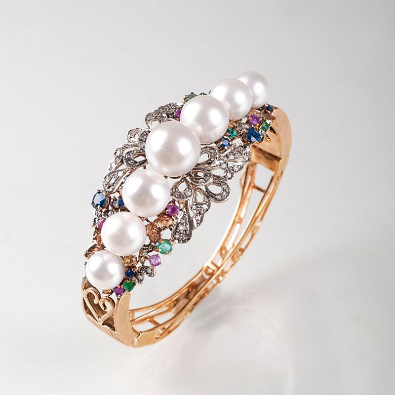 An extraordinary bangle bracelet with precious stones and diamonds