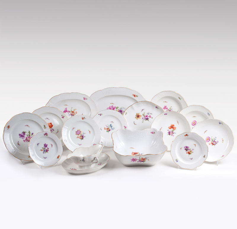 A KPM part dinner service with flowers and butterflies