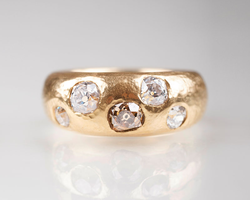 A gold ring with old cut diamonds