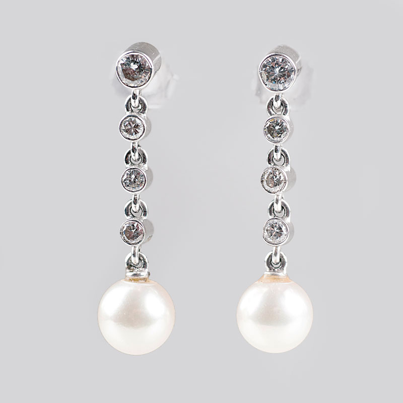 A pair of pearl diamond earpendants