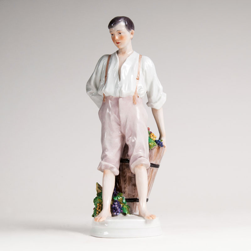 A Porcelain Figure 'Boy with Vine Pannier'