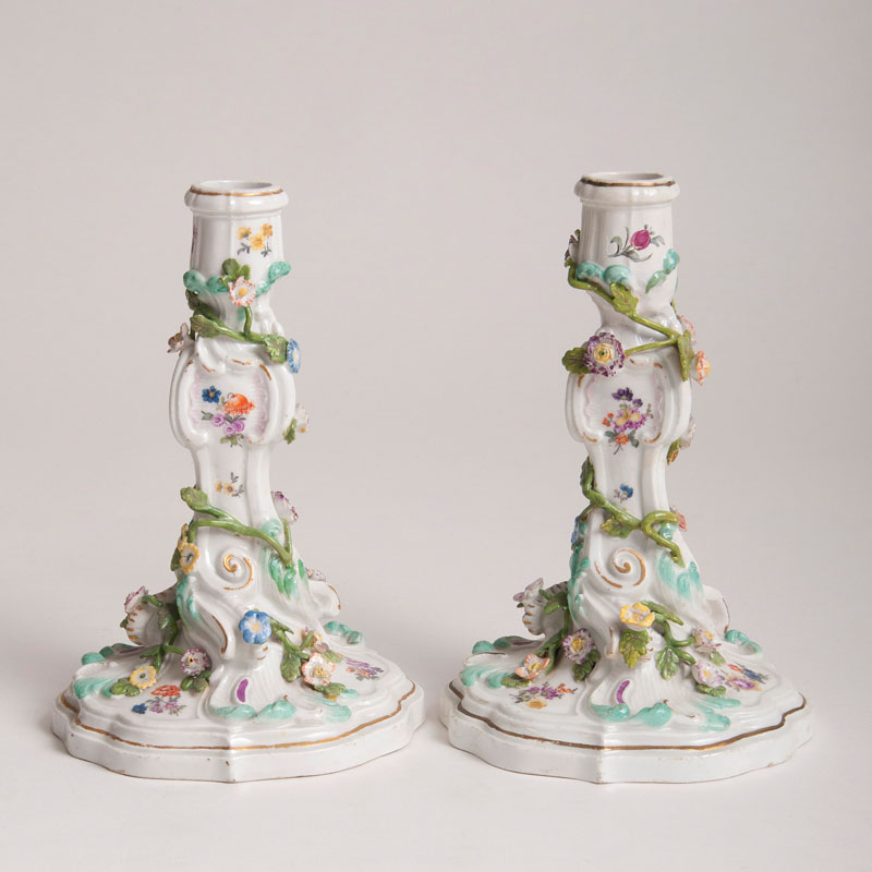 A pair of Rocaille candlesticks with flower decor