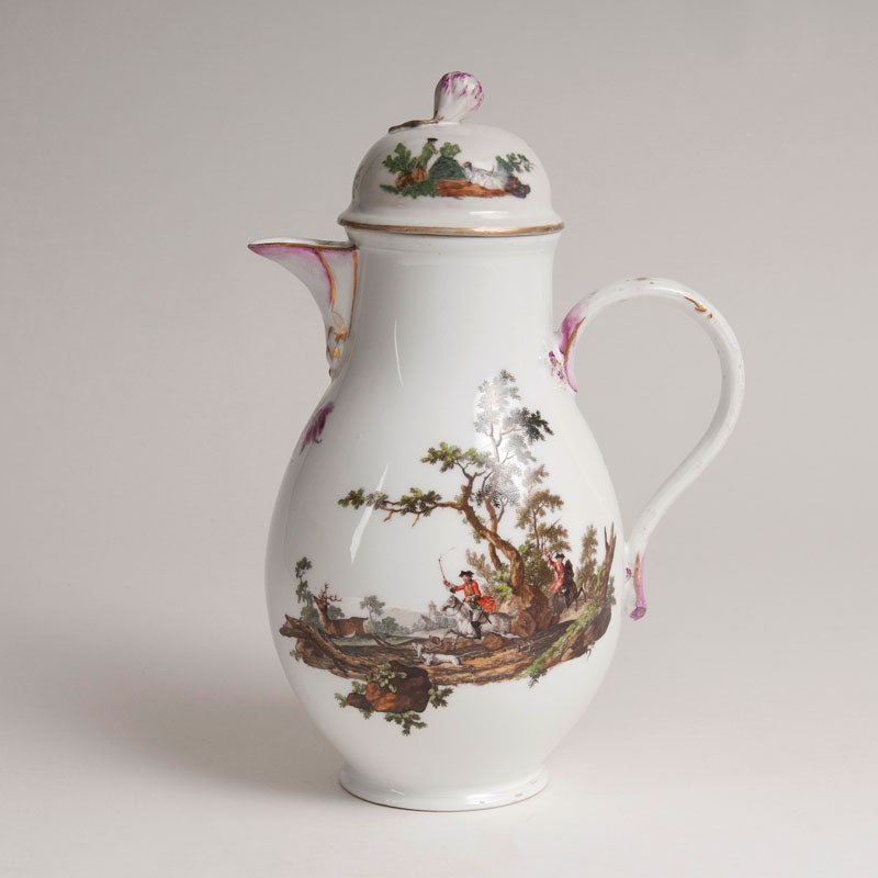 A coffee pot with hunting scenes