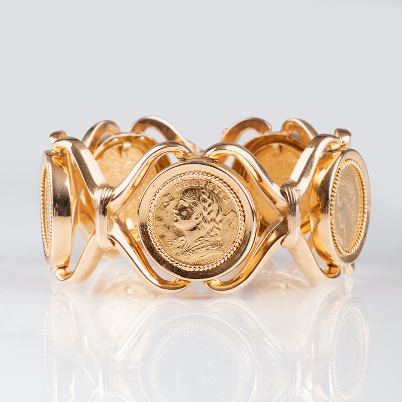 A golden bracelet with 5 coins