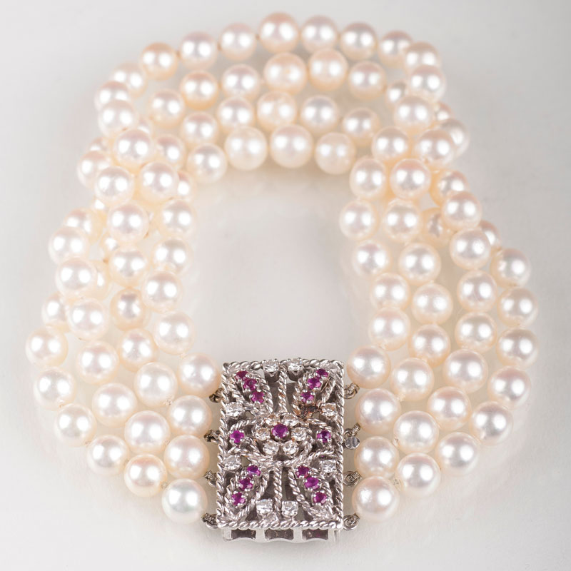 A pearl bracelet with a ruby diamond clasp