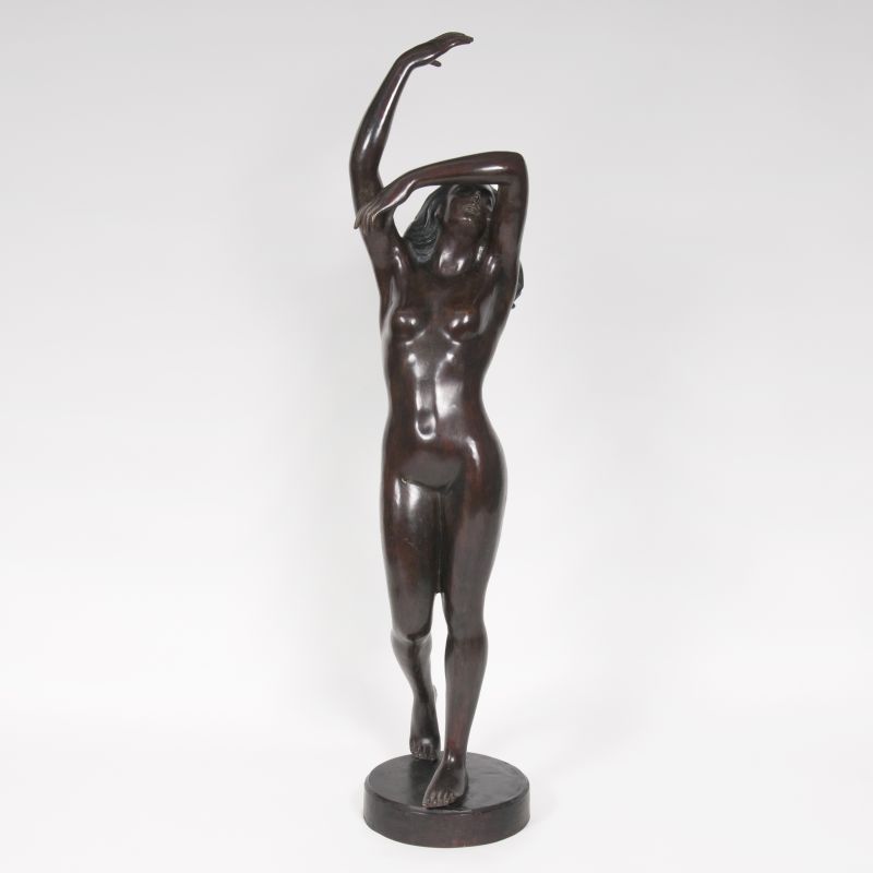 A tall bronze sculpture 'Dancing female nude'