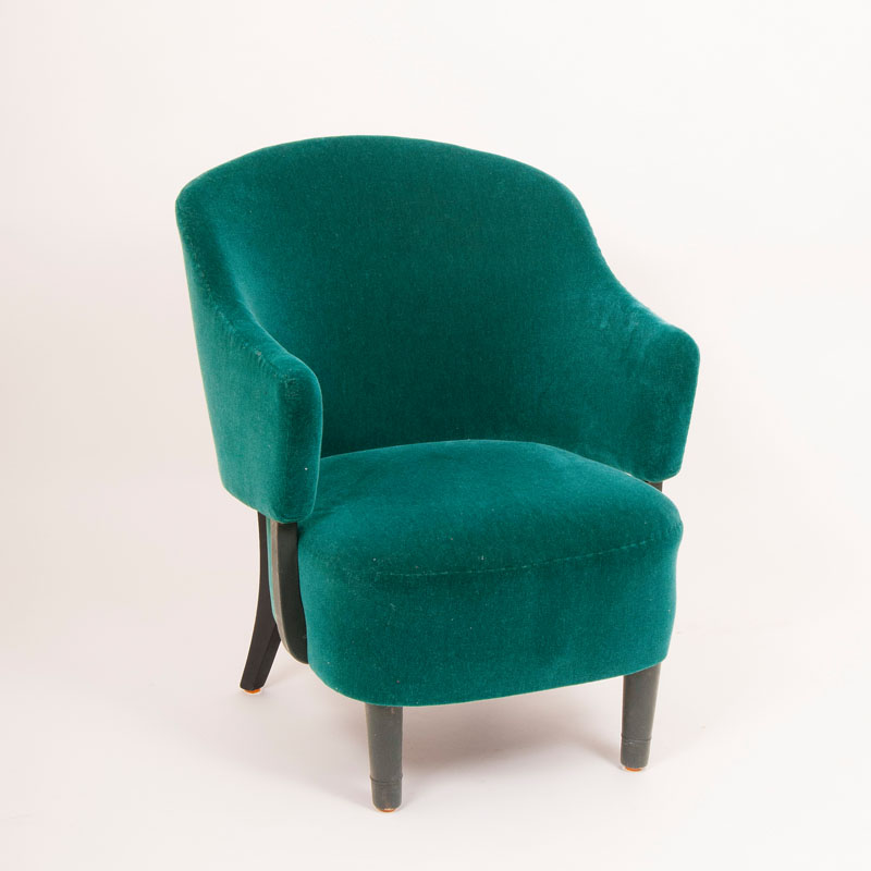 A bottle-green Mid Century easy chair