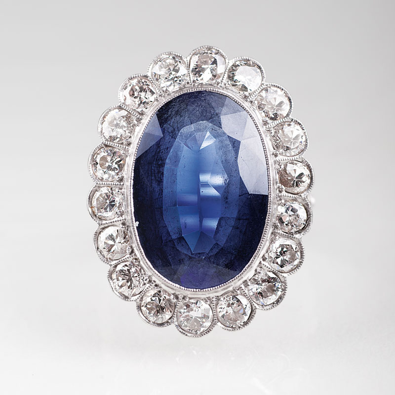 A platinum ring with diamonds and synthetic sapphires