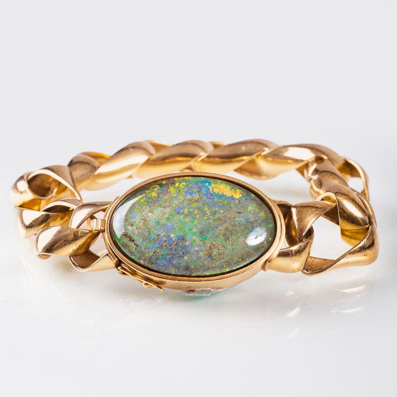A golden bracelet with opal clasp