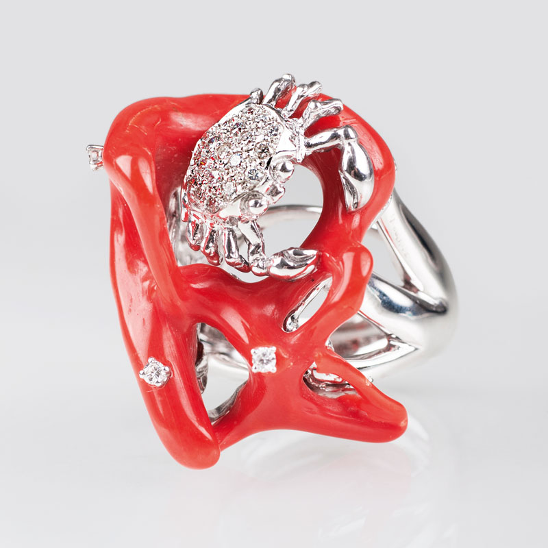 A modern coral diamond ring