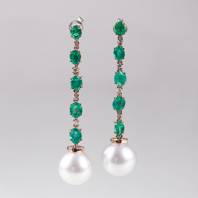 A pair of Southsea pearl earpendant with emeralds and diamonds