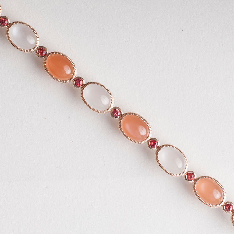 A two-coloured moonstone bracelet with sapphires