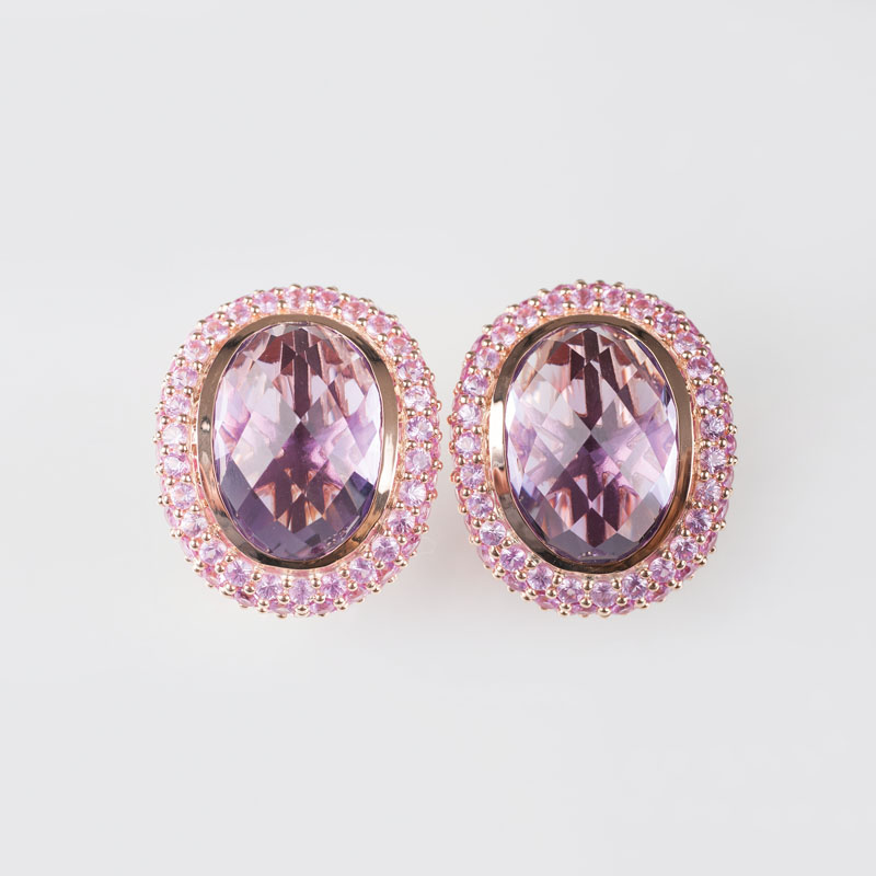 A pair of amethyst earstuds with pink sapphires