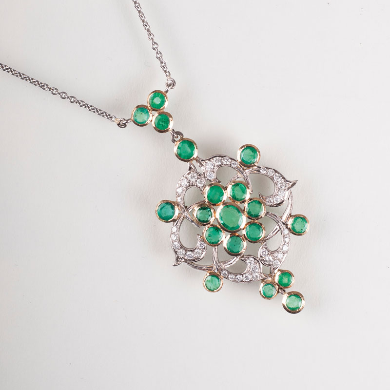 An emerald diamond pendant with necklace