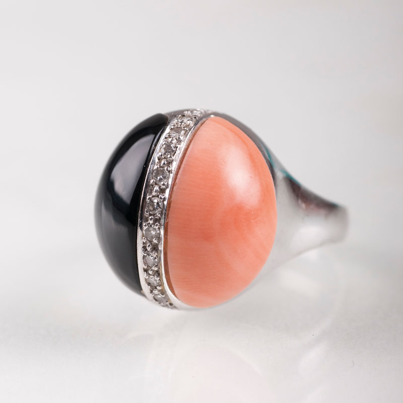 An onyx coral ring with small diamonds