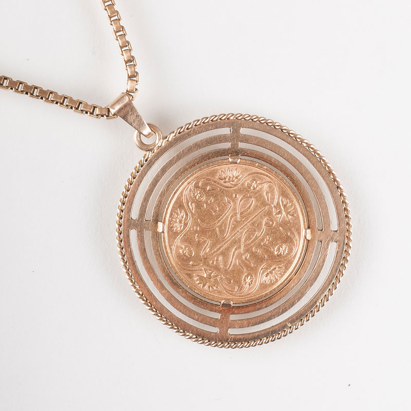 A coin pendant with necklace
