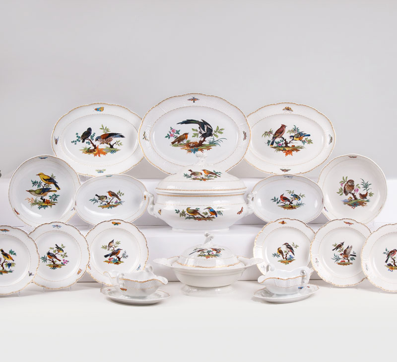 An extensive  dinner service for 11-12 persons with bird painting