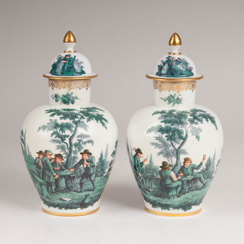 A pair of lidded vases with copper green Teniers painting