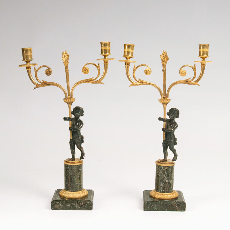 A pair of small Empire chandeliers with putto
