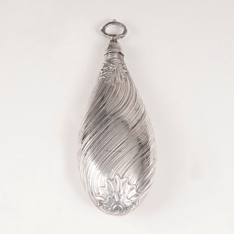 A silver perfume flacon in drop shape