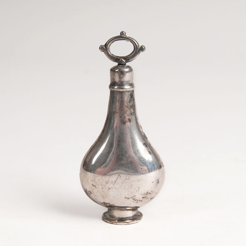A small silver perfume flacon in pear shape