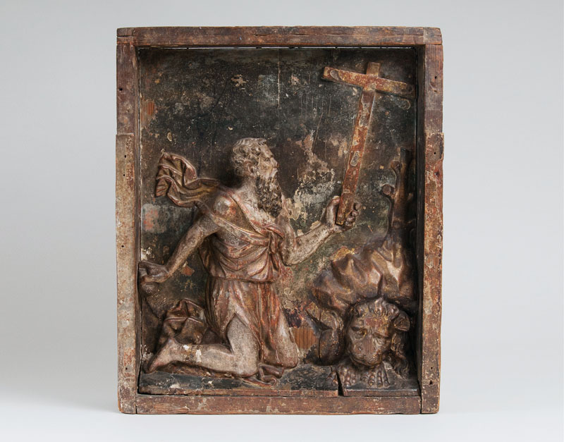 A wooden relief 'Saint Jerome in the wilderness'