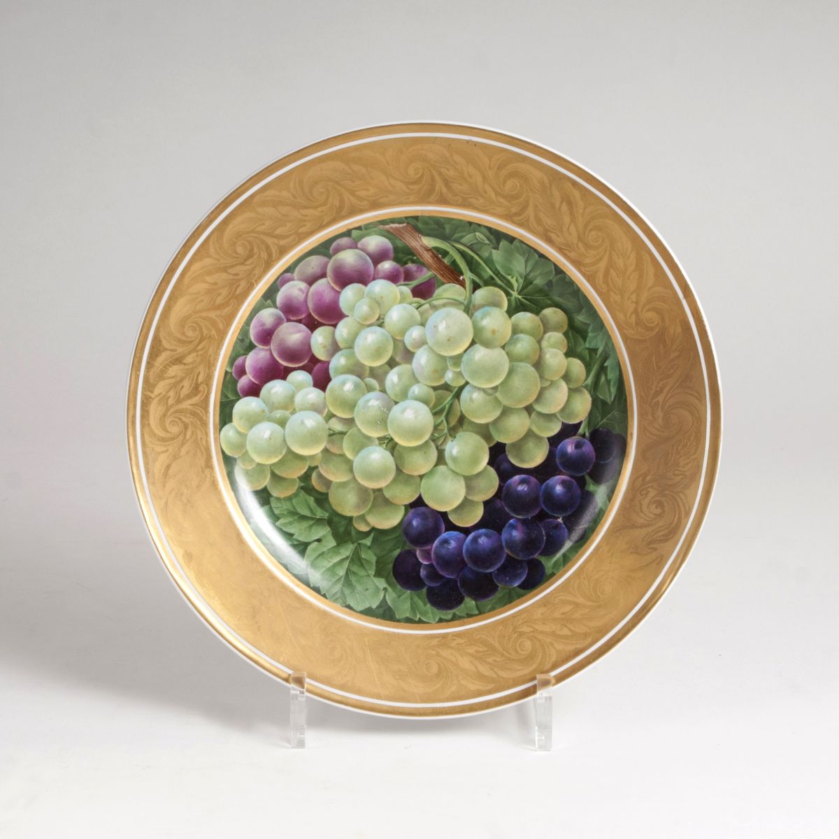 A plate with opulent grape decor