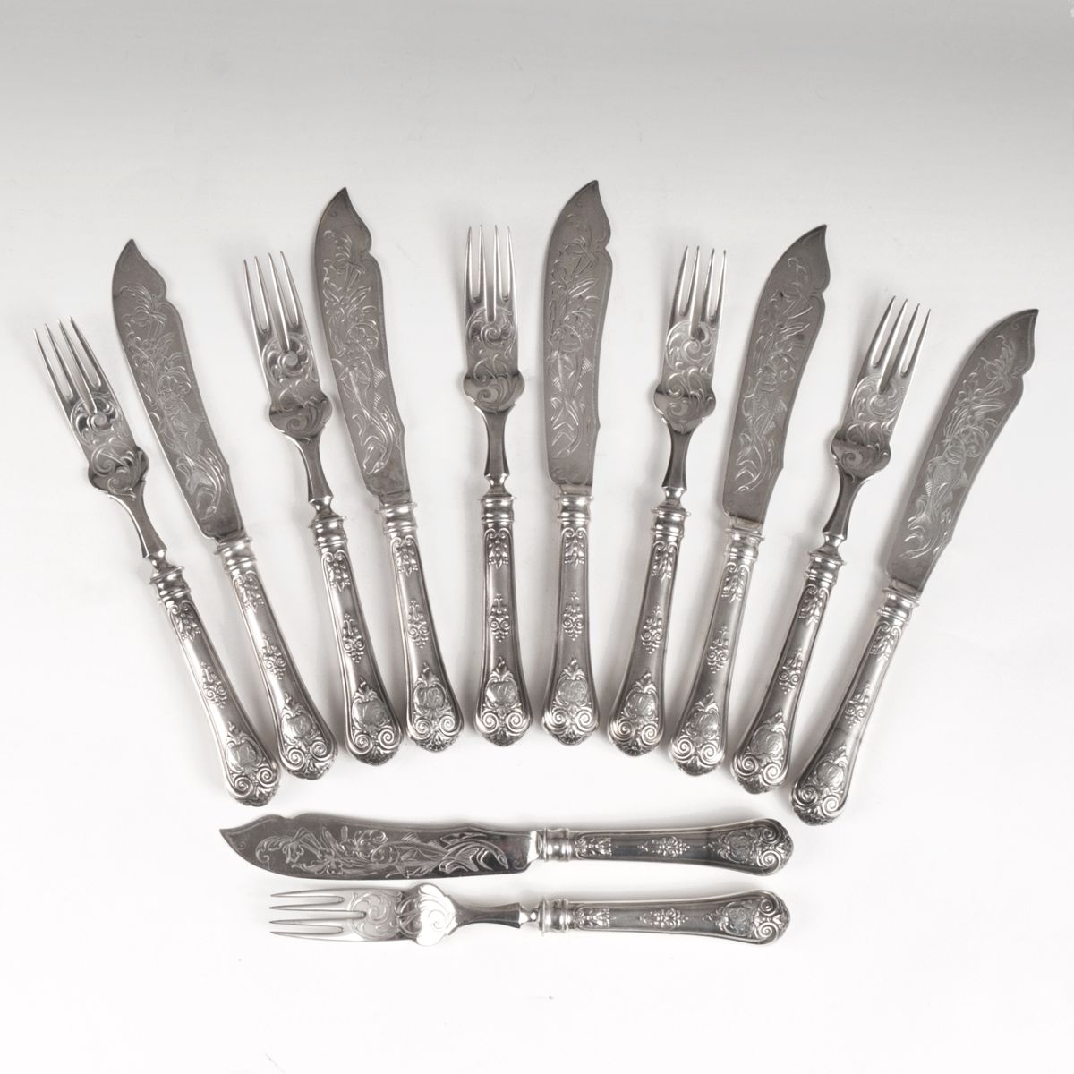 A richly decorated fish cutlery