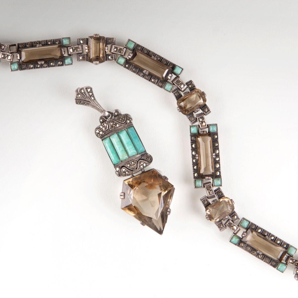 An Art Déco bracelet and pendant with smoky quartz