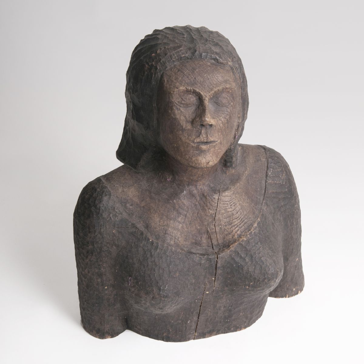 A wooden sculpture 'Bust of a young lady'