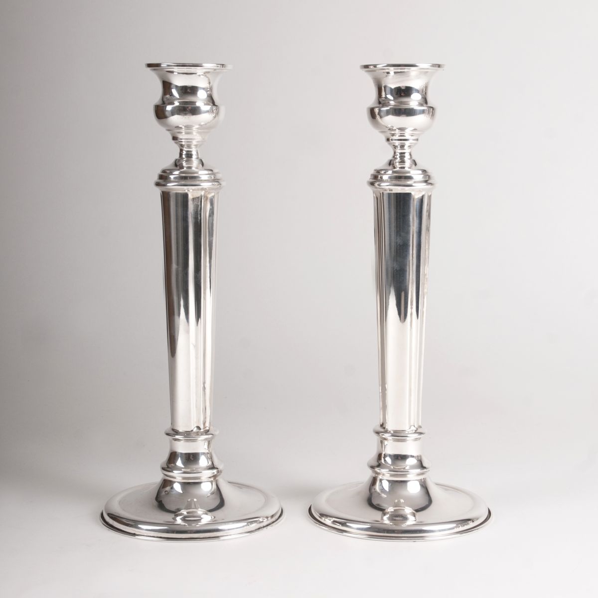 A pair of large table candle holders