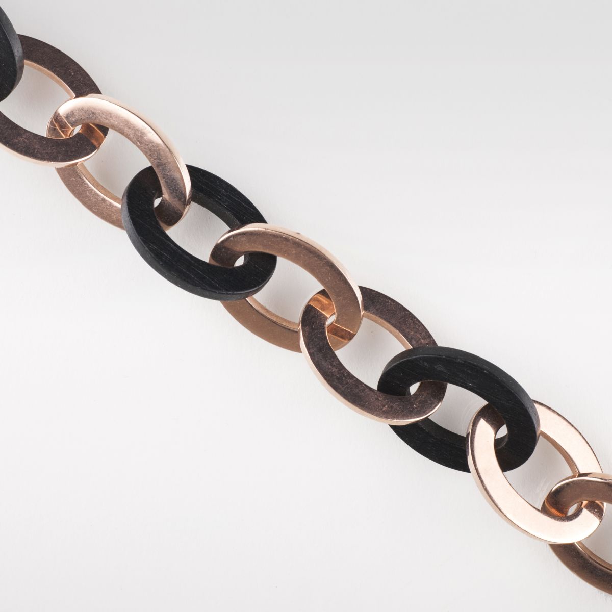 A redgold bracelet with wooden chain links