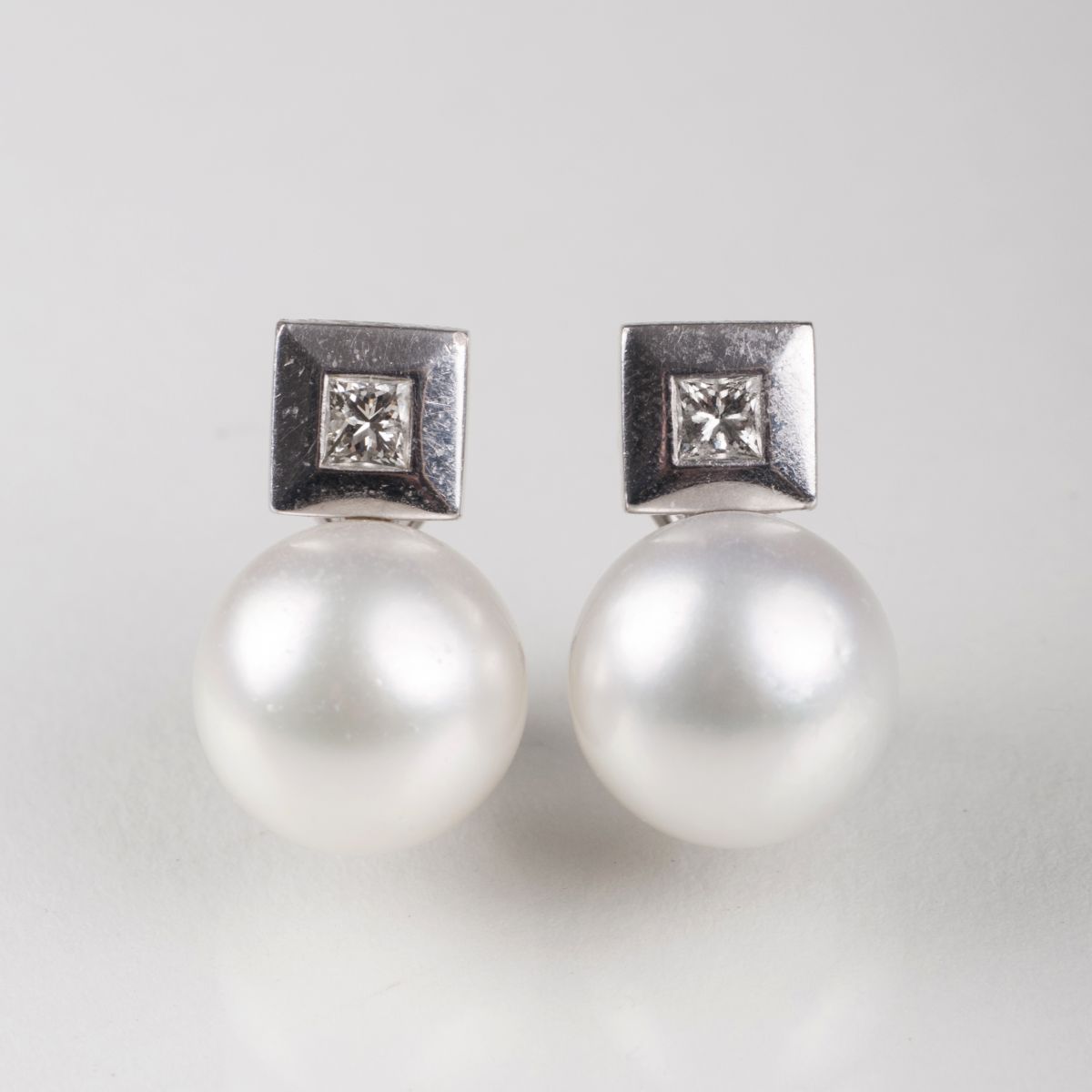 A pair of Southsea cultured pearl diamond earrings