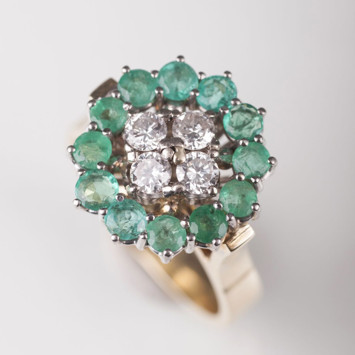 An emerald diamond ring