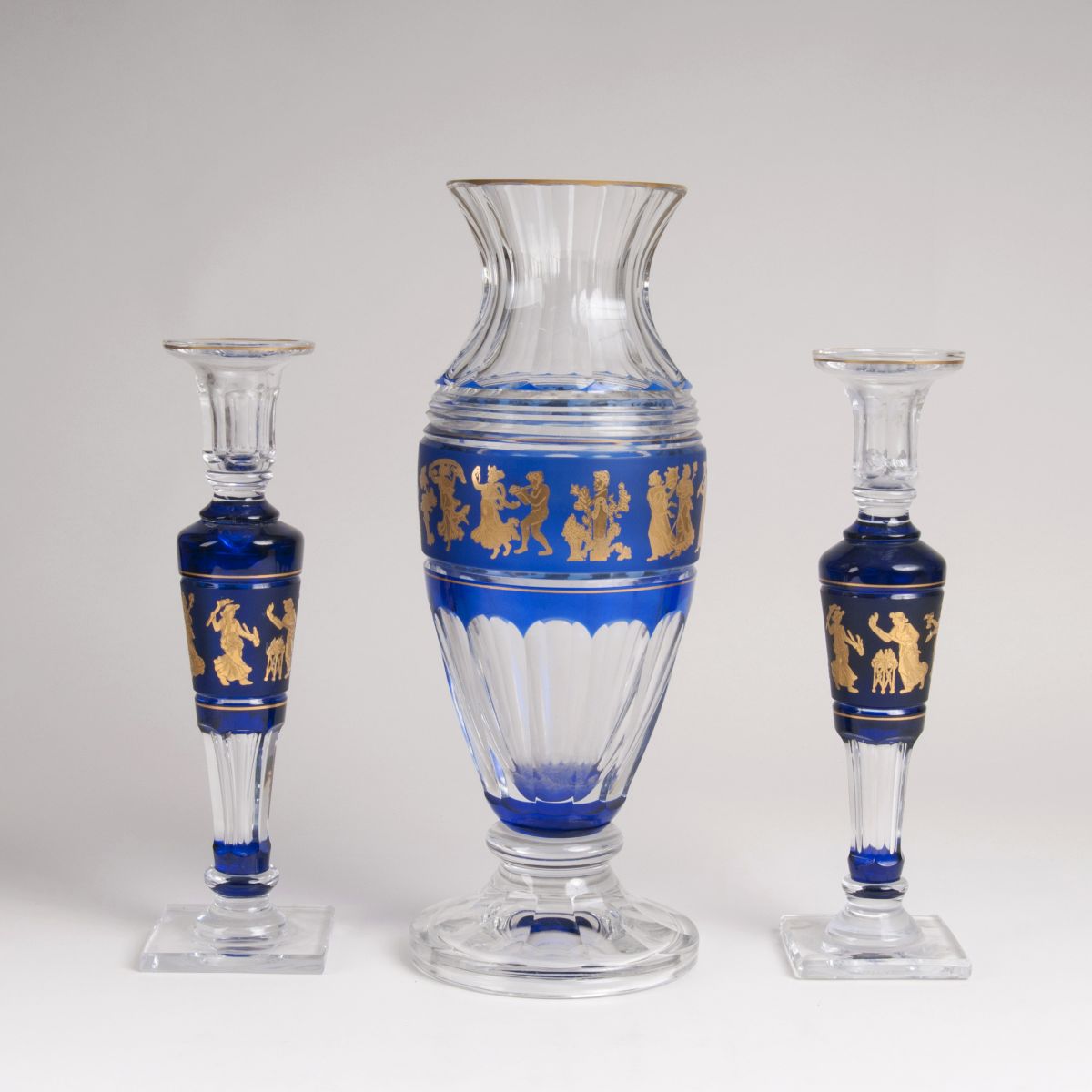 - A 'Périclès' vase and pair of candlesticks from the series 'Danse de flore' A 'Périclès' vase and pair of candlesticks from the series 'Danse de flore'