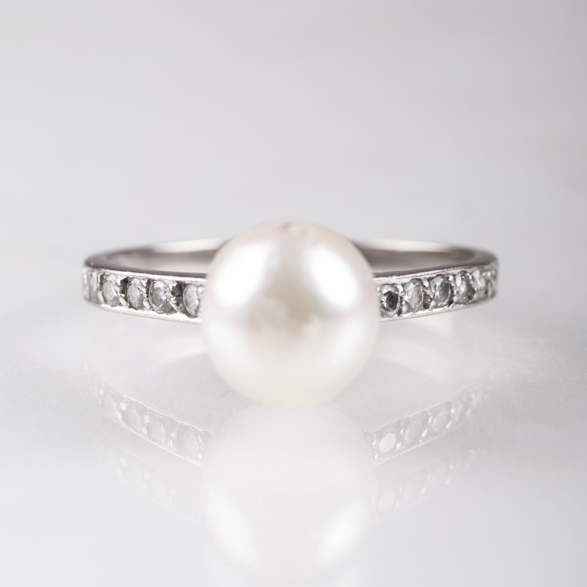 A petite pearl diamond ring
