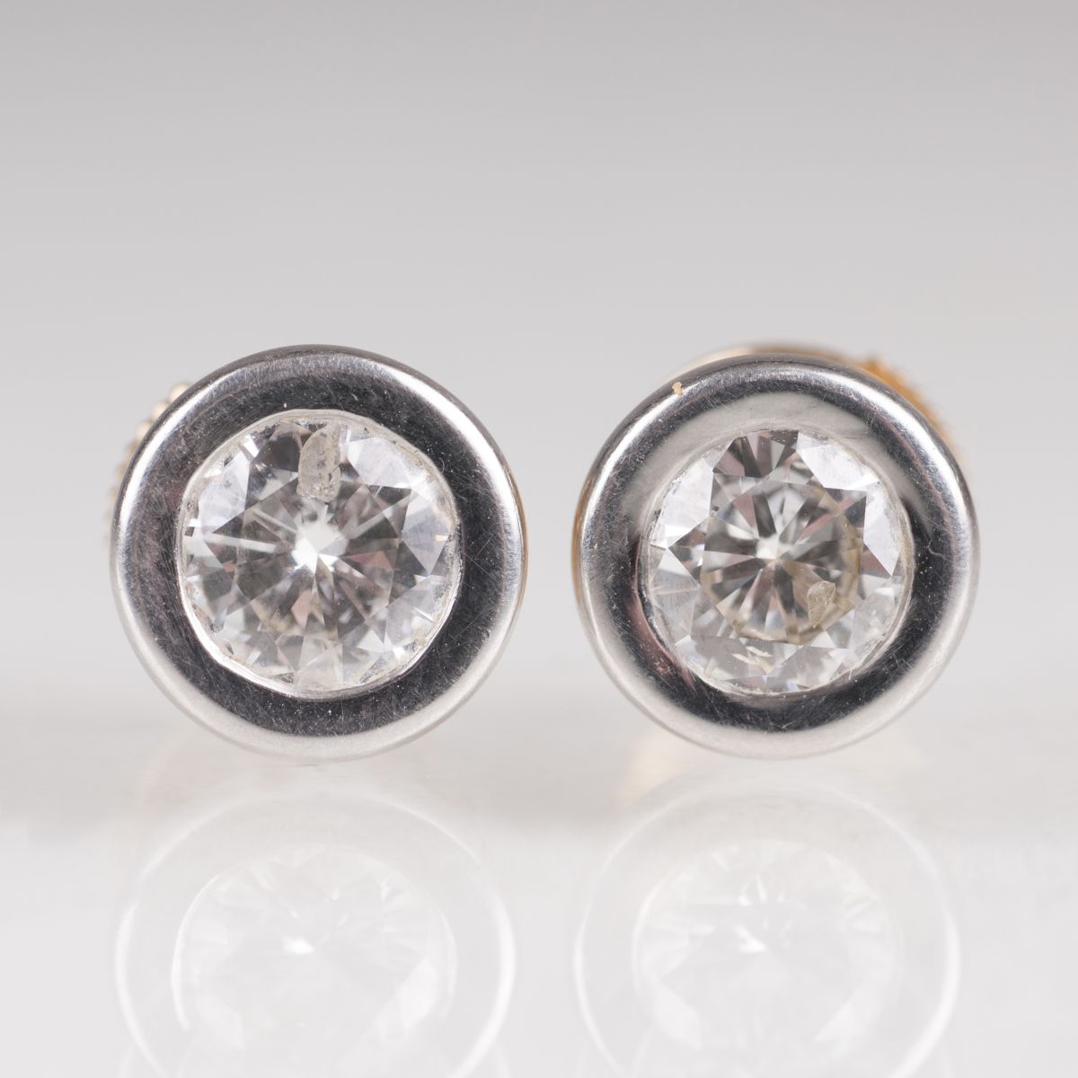 A pair of solitaire diamond earstuds