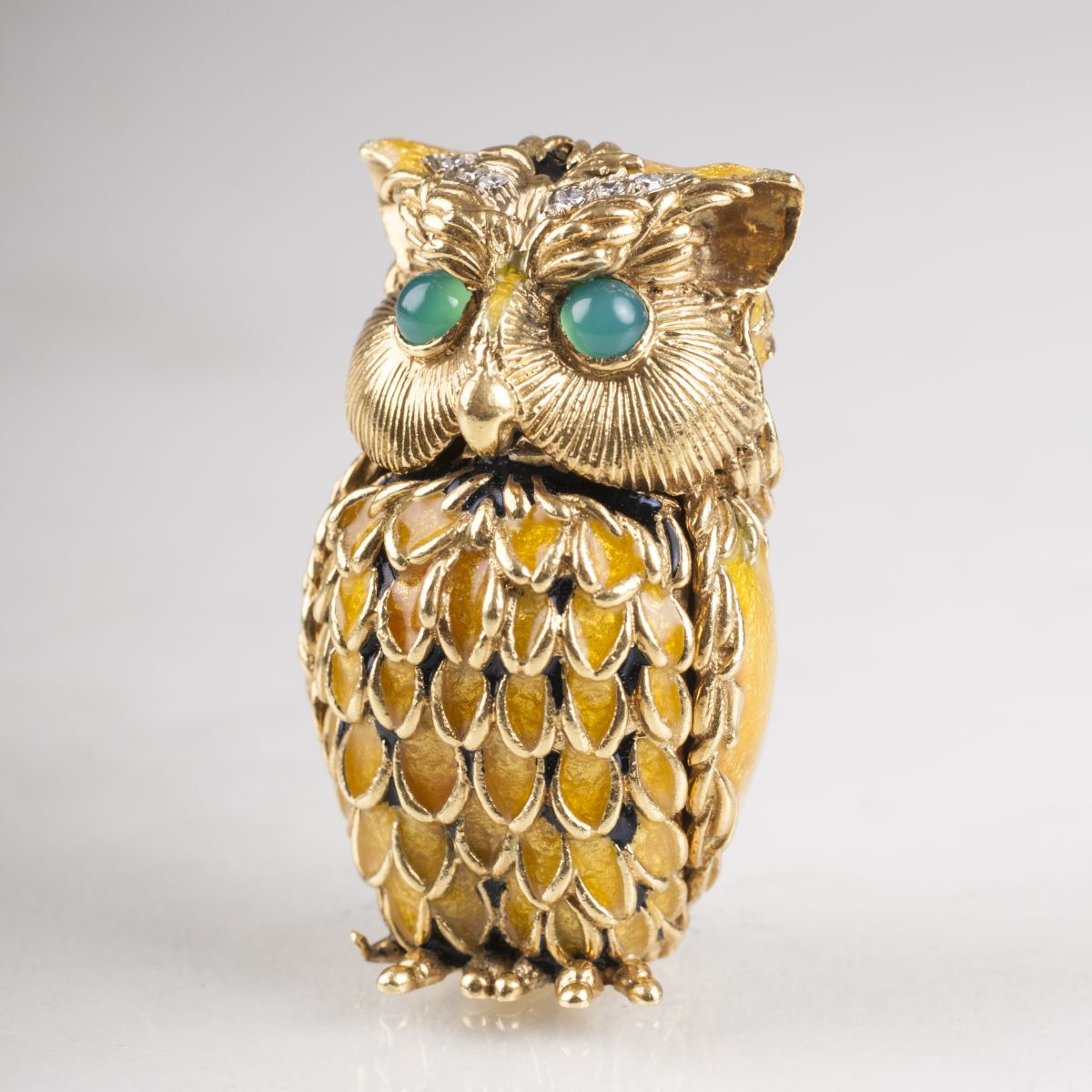 A miniature golden box 'Owl' with diamonds