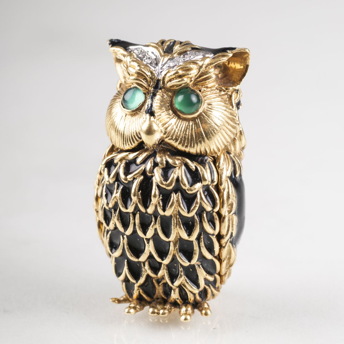 A miniature golden box 'Owl' with diamonds
