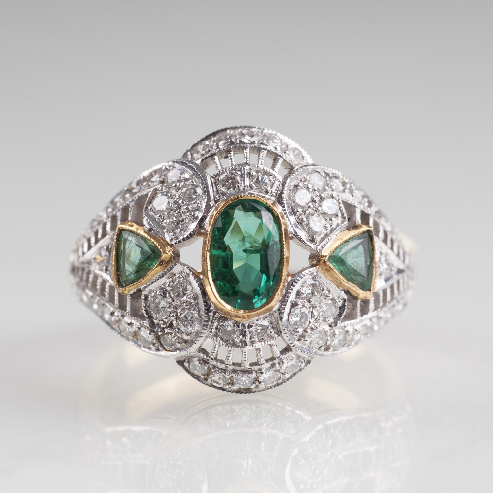 An emerald diamond ring