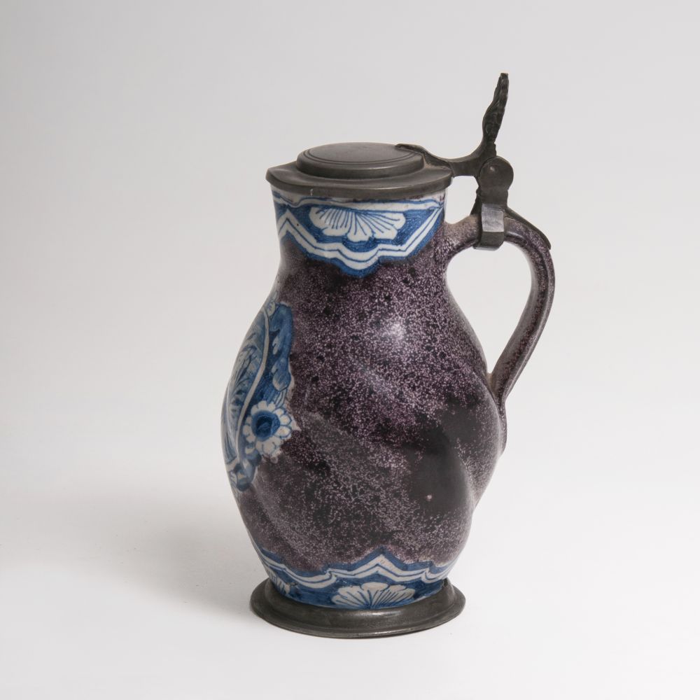 A small pear-shaped jug with speckled ground and blue painting - image 3