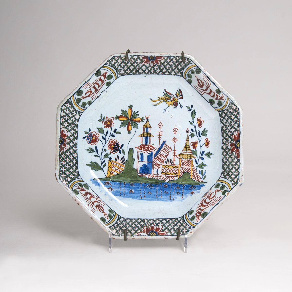 A faience plate with chinoiserie decor